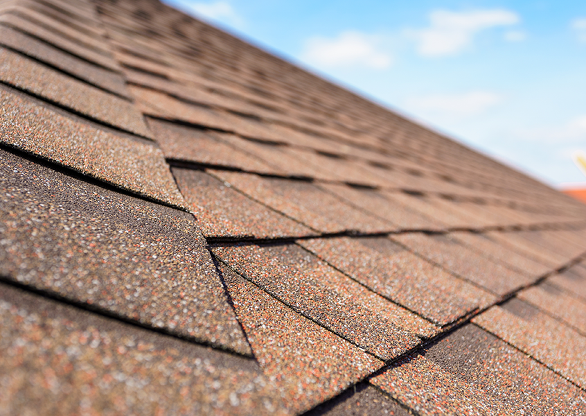 Asphalt shingle roof closeup repair